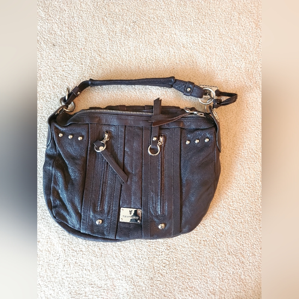 Frye black leather shoulder bag with front zipper.